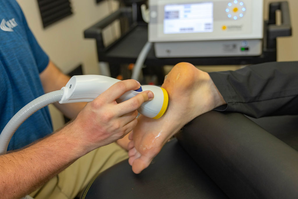SoftWave applicator treating a heel at Muscle Restoration Therapy, Fort Collins.